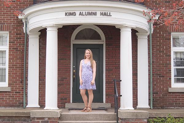 Becca standing in front of king hall