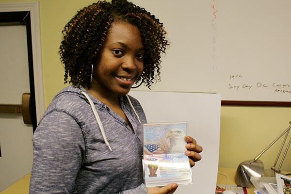 Tiana holding passport