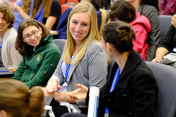 Women in computing interacting with one another