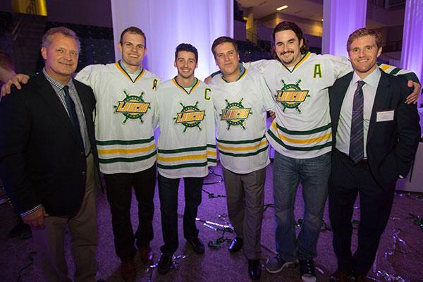 Steve Levey with Coach Gosek and Oswego hockey players