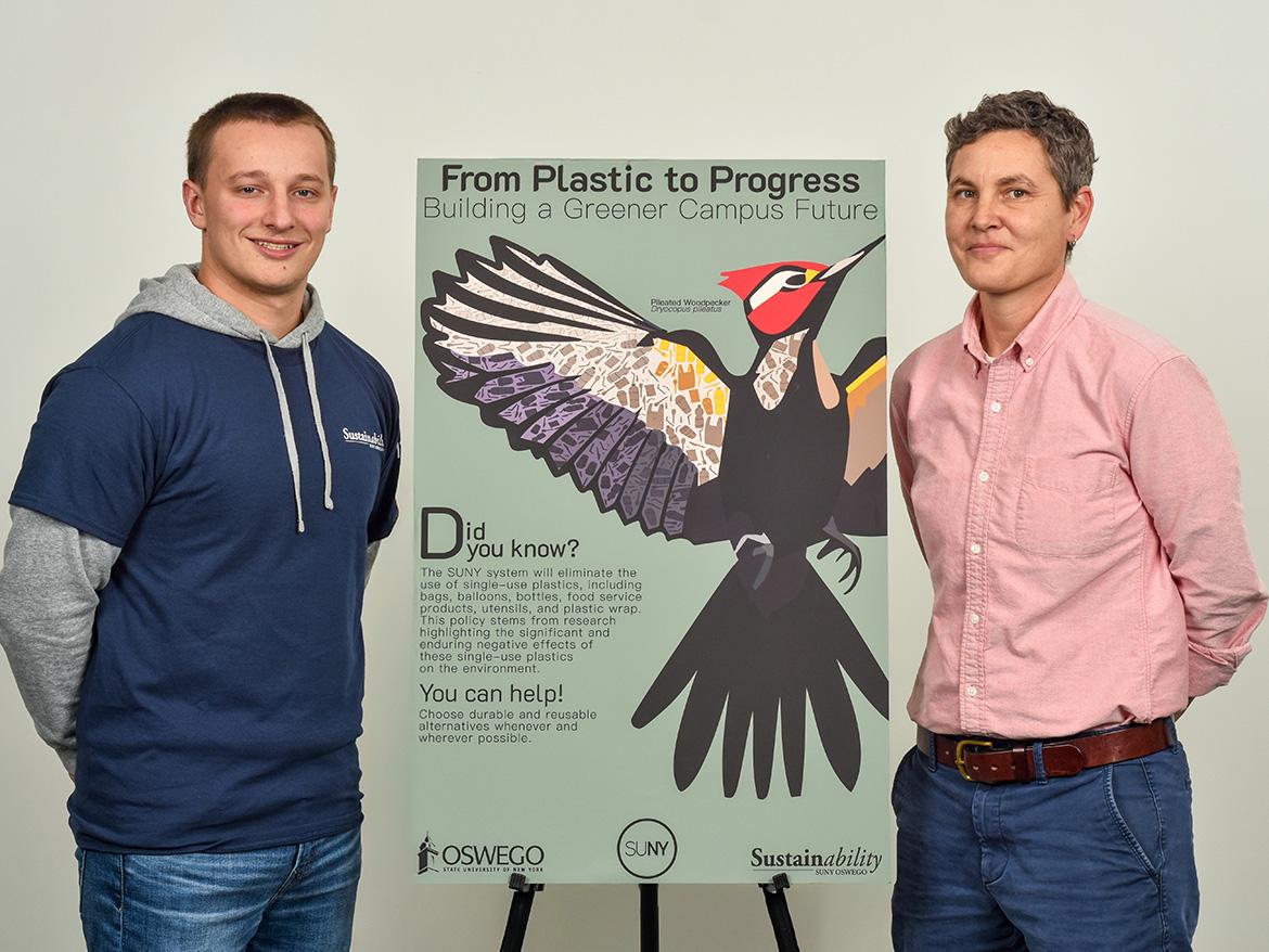 student and professor presenting research with a poster project