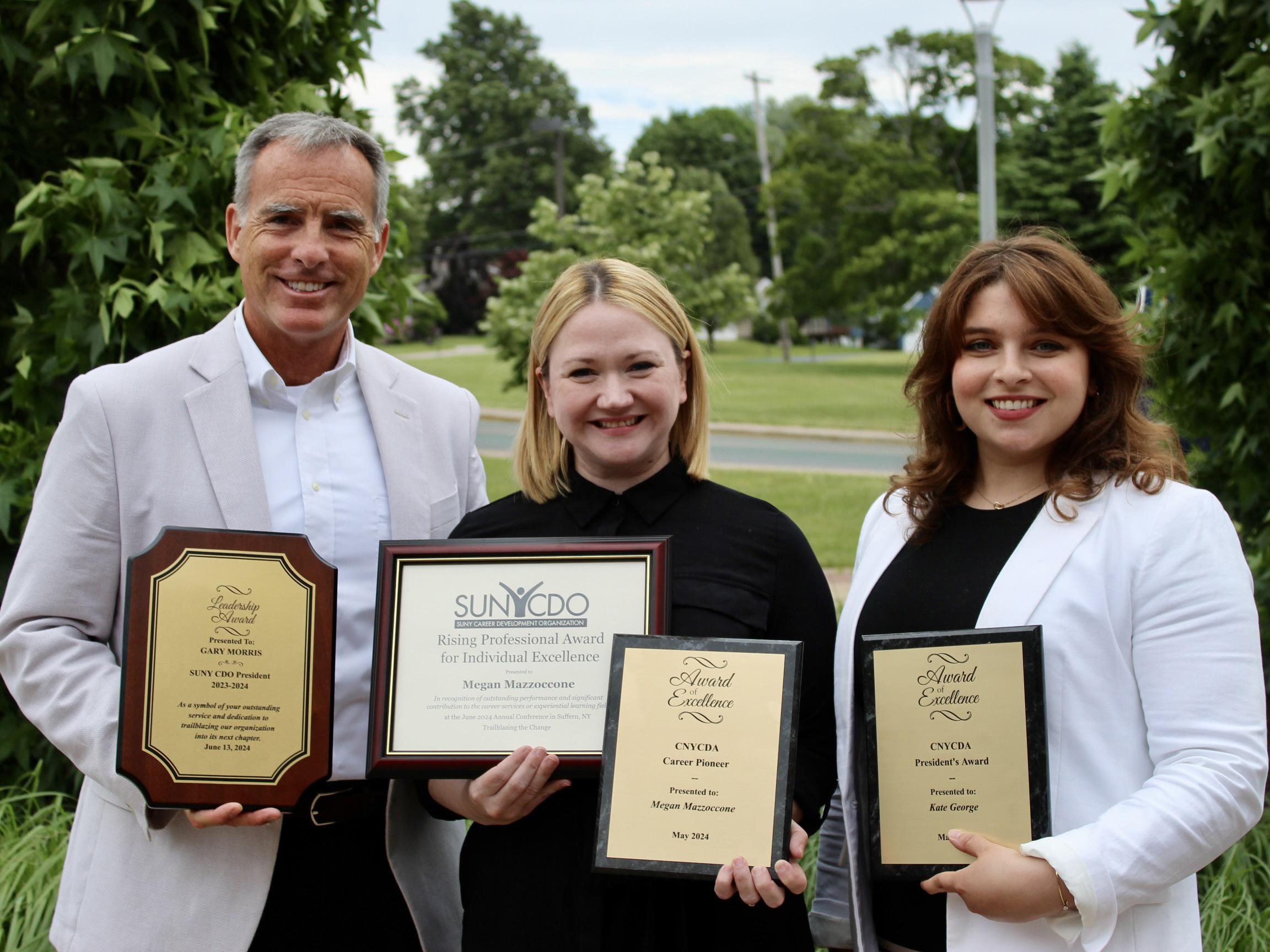 From left, Career Services staff members Gary Morris, Megan Mazzoccone and Kate George recently received awards from state organizations