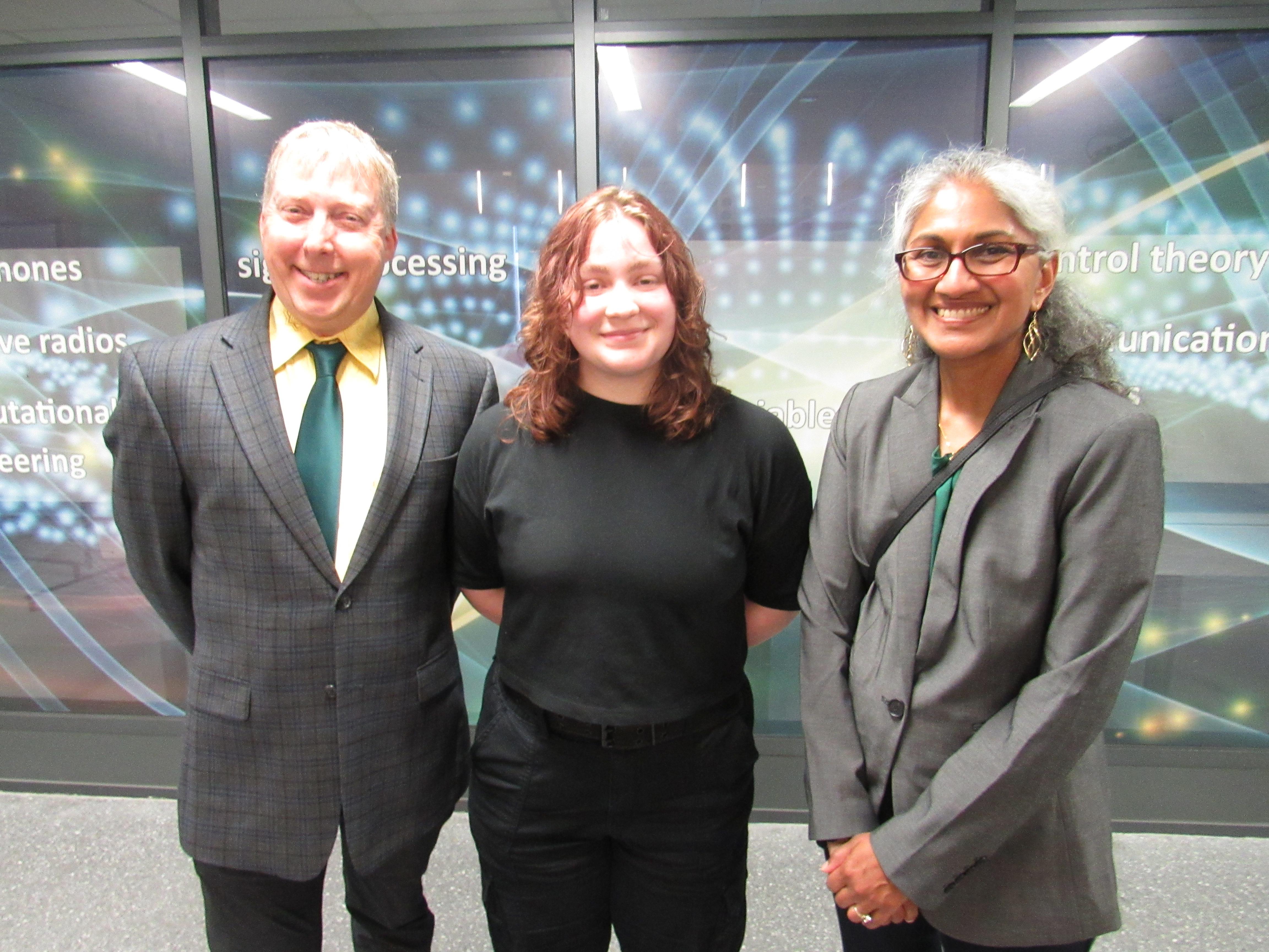 Benefactors Bruce Ellsworth, a 1987 graduate, and Geeta Govindarajoo meet with their chemistry scholarship recipient, Emily Harte this spring in the Shineman Center.