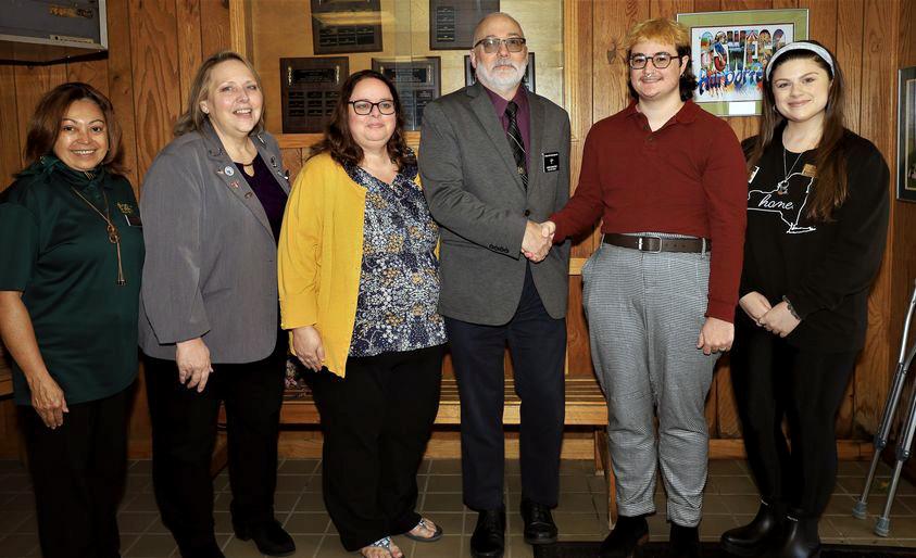 Representatives of SUNY Oswego and Students Helping Oz Peers thank representatives of the Elks Club of Oswego for their donation