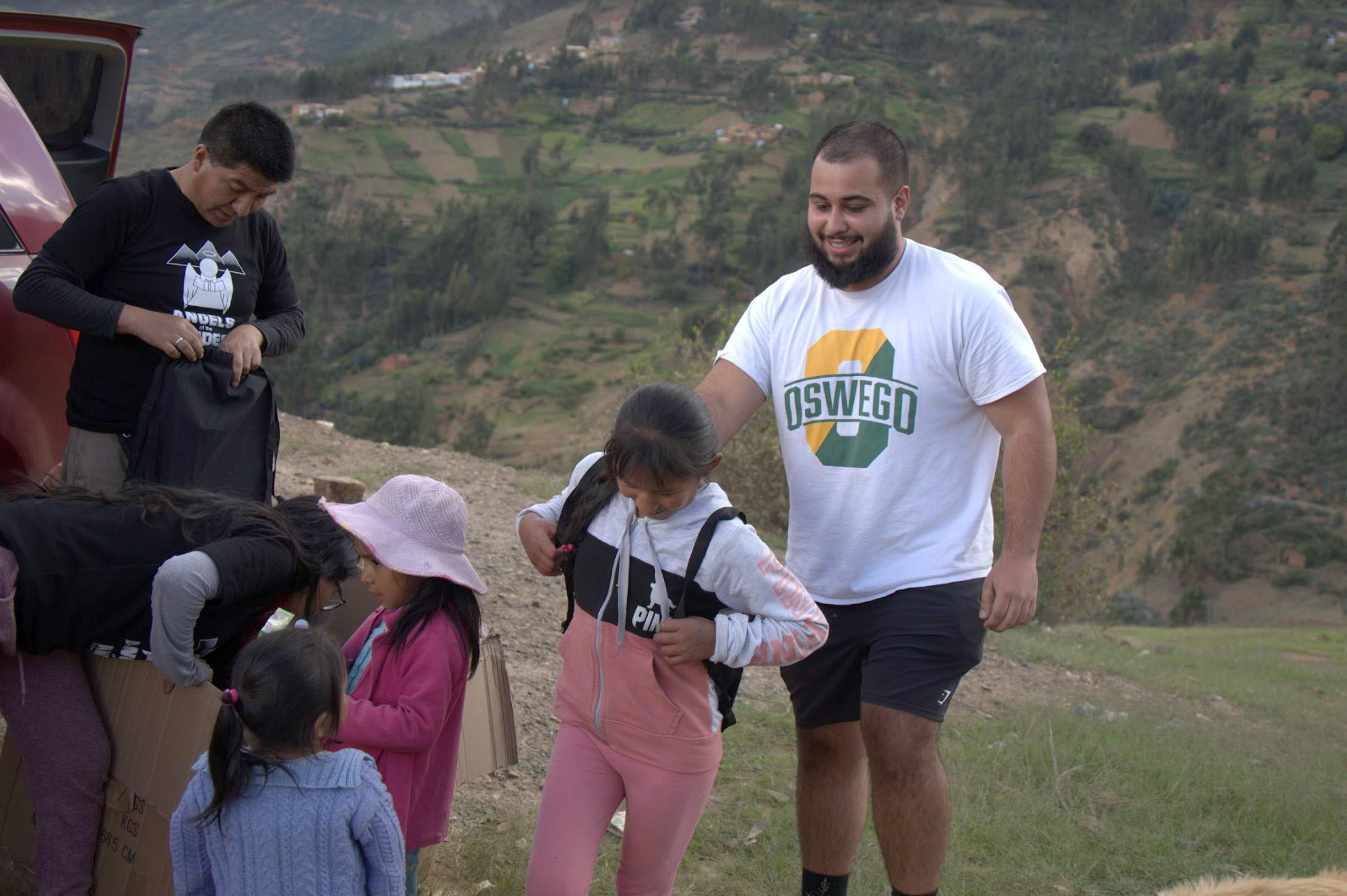 May 2024 SUNY Oswego graduate Zachary Nusimow helps distribute supplies and more to families in the Andes Mountains of Peru