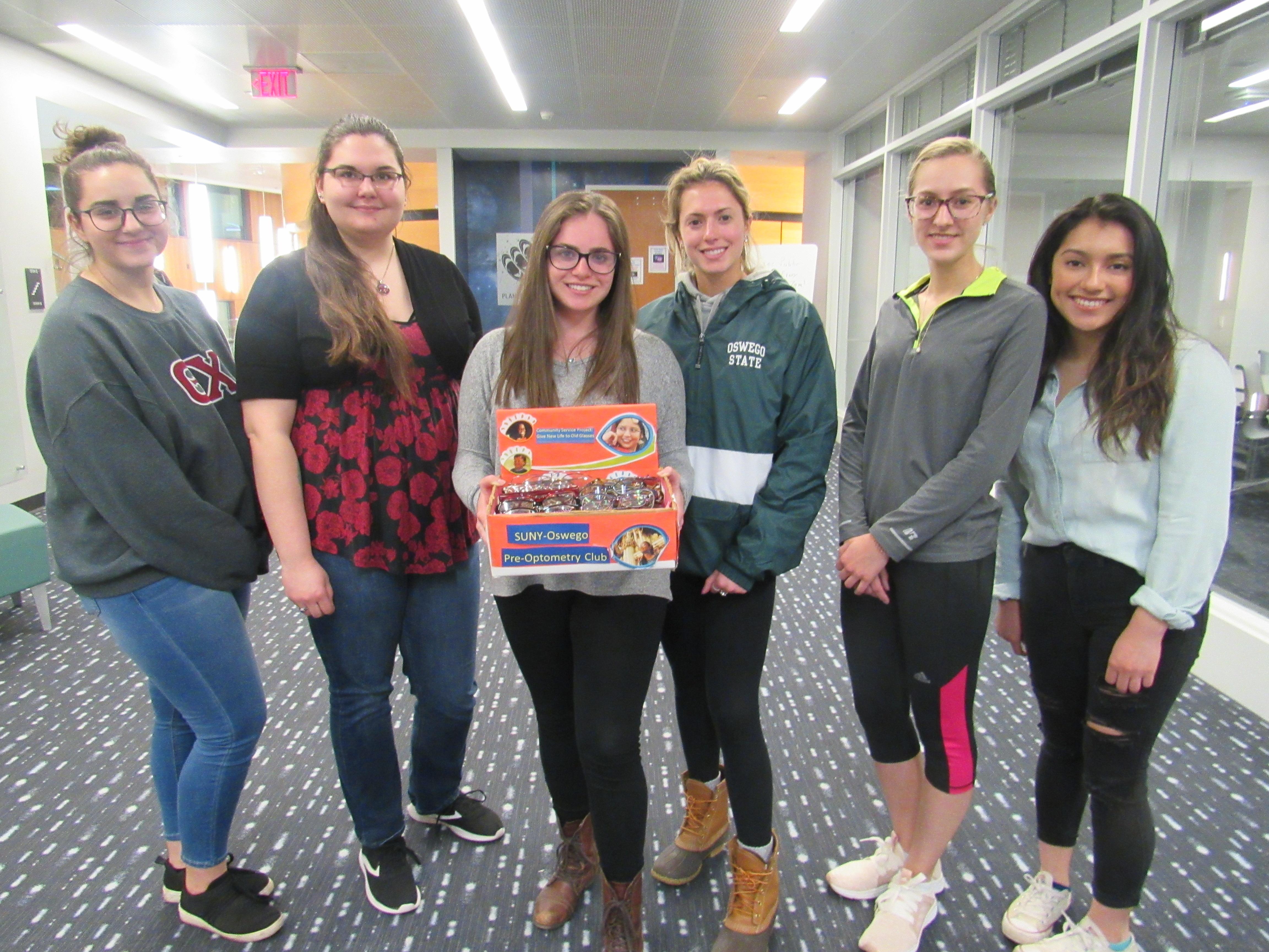 Pre-Optometry Club members promoting the donation of used glasses