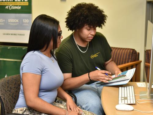 Rosely Paulino and Jeudin Alvarez are among the peer mentors in SUNY Oswego's new Money Matters financial literacy program.