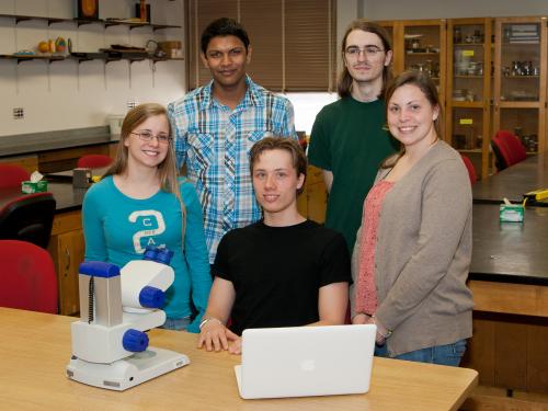 5 original Possibility Scholars in a lab