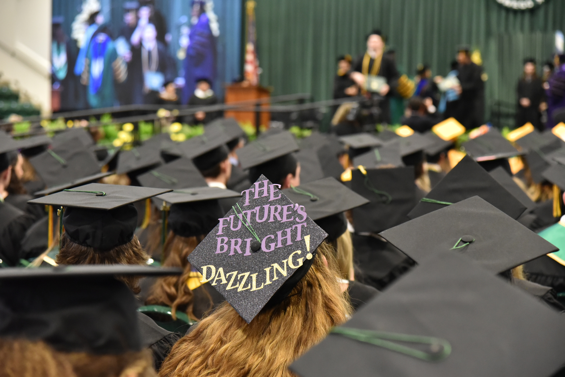 A graduate’s cap message looks forward to a bright and dazzling future.