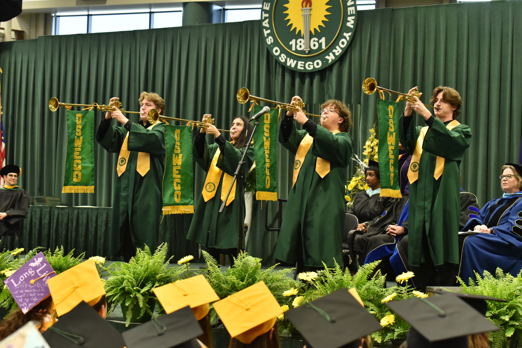 Trumpeters signal the conclusion of the School of Business ceremony held at 12:30 p.m., the second of three Commencement ceremonies on Saturday, May 11.