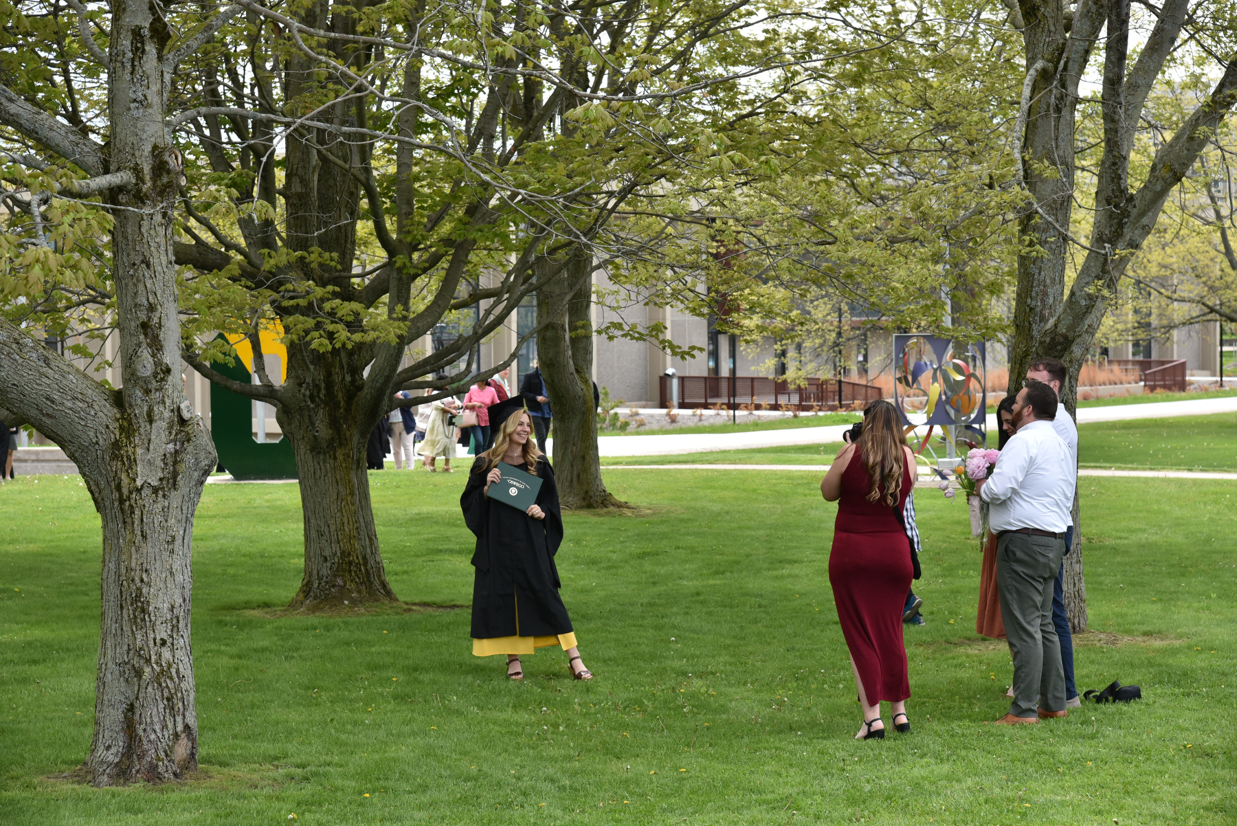 SUNY Oswego's scenic campus provides a backdrop for post-Commencement photos.