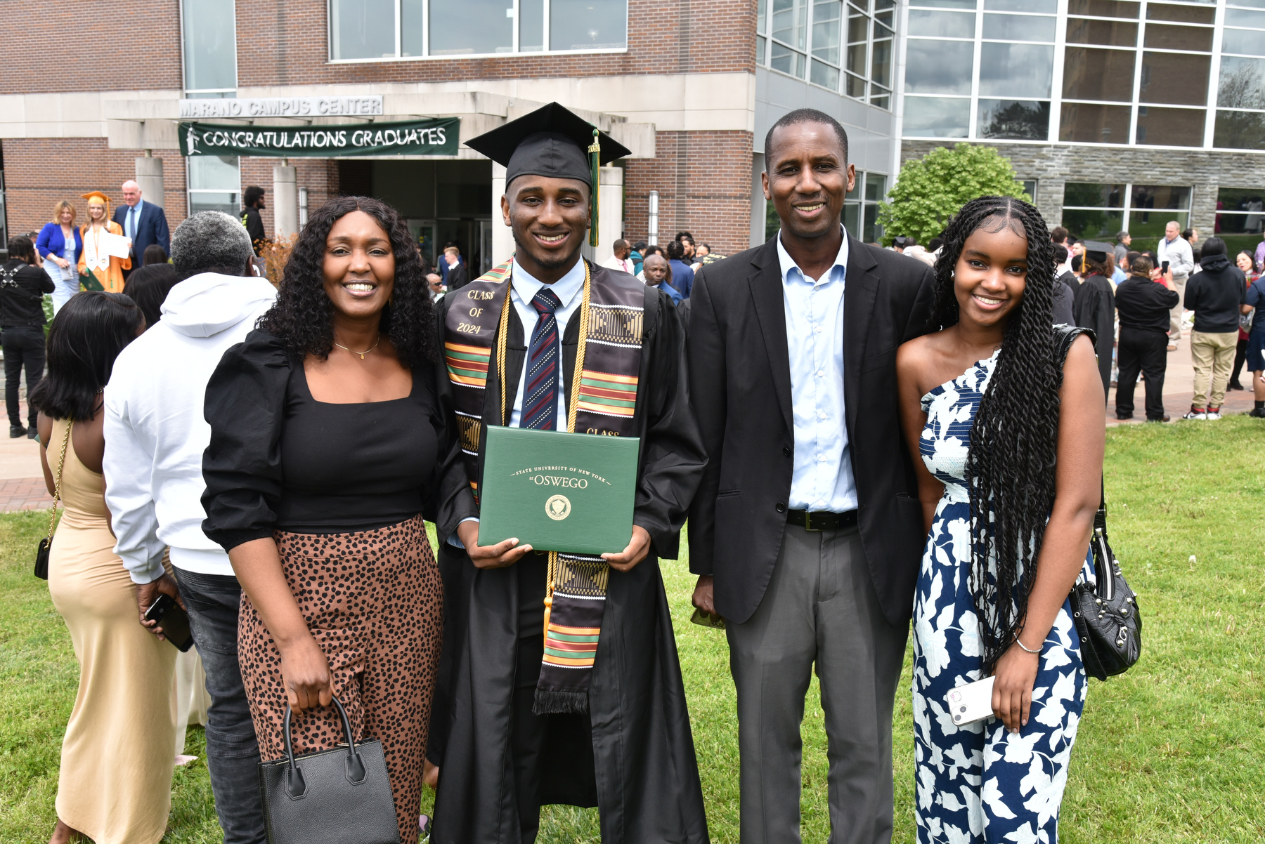 Graduates and their families celebrate after the School of Business ceremony.