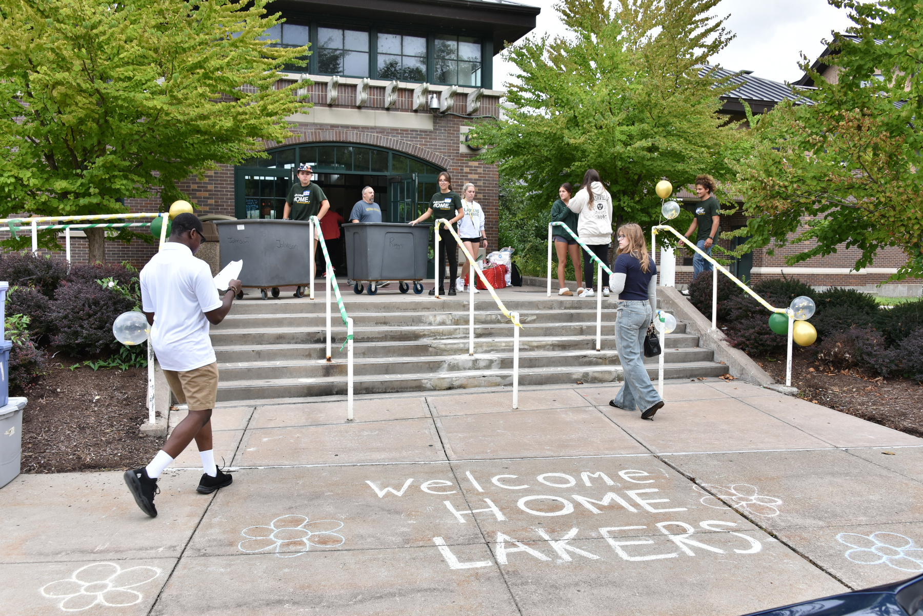 Residence halls across campus were busy as many students moved in Aug. 21. Pictured is the activity at Johnson Hall, as first-year students are welcomed to their new home.