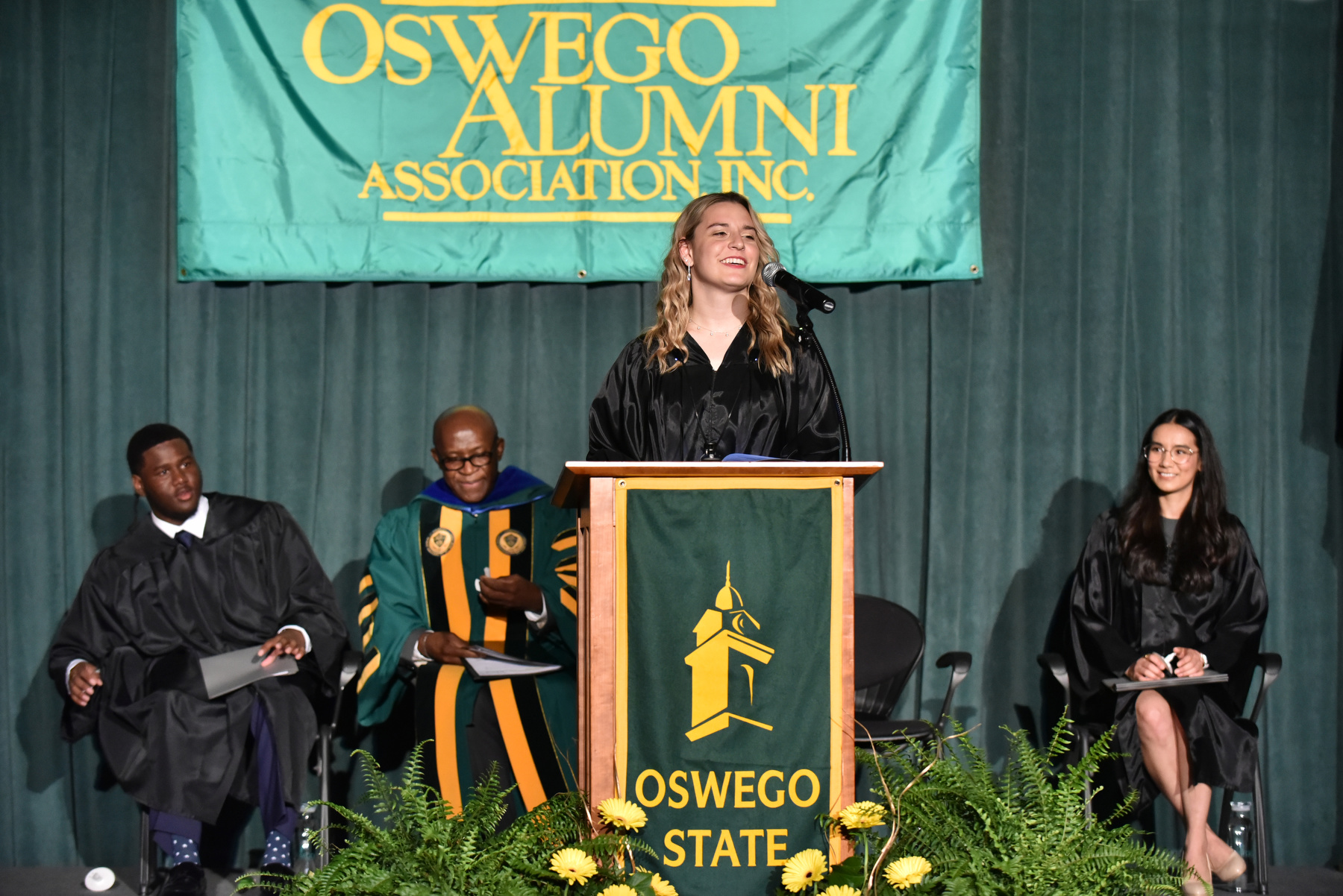 Senior Melinda Brancato serves as student speaker for the 35th annual Welcoming Torchlight Ceremony.