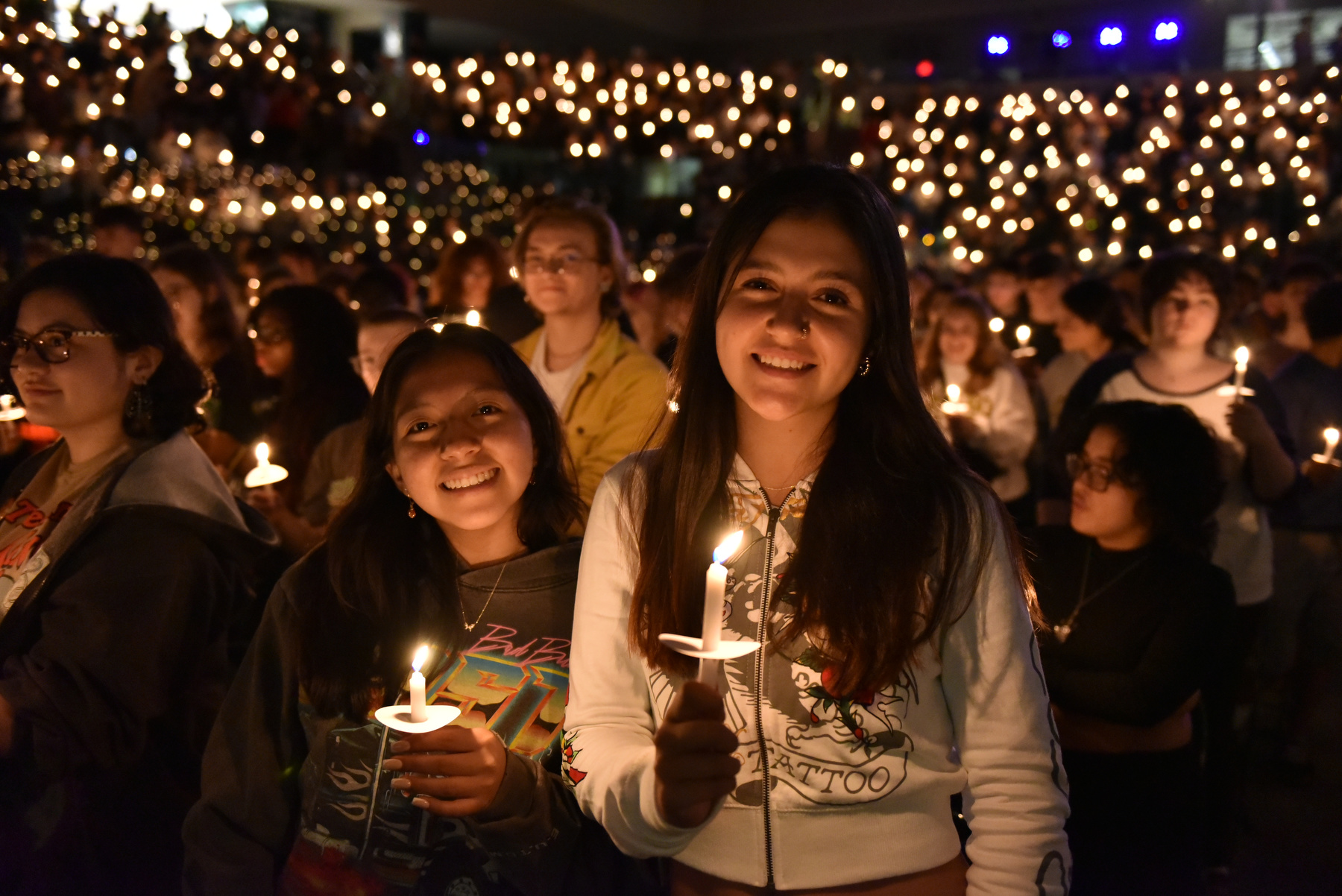 Students hold candles during the Welcoming Torchlight Ceremony.