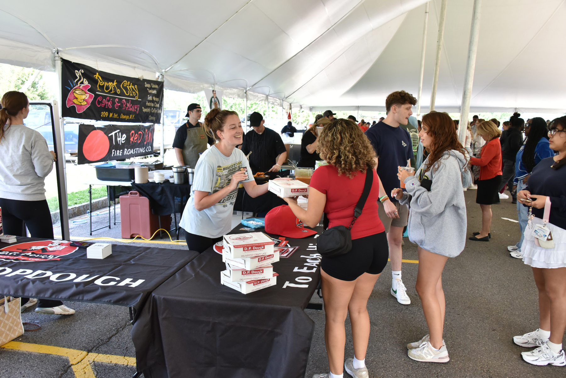 Businesses from the local Oswego area such as D.P. Dough, pictured, visited the campus during opening week at Taste of Oswego on Aug. 22 between Marano Campus Center and Penfield Library. Local food vendors share their dishes with the newest Lakers to provide a flavor of what local businesses have to offer.