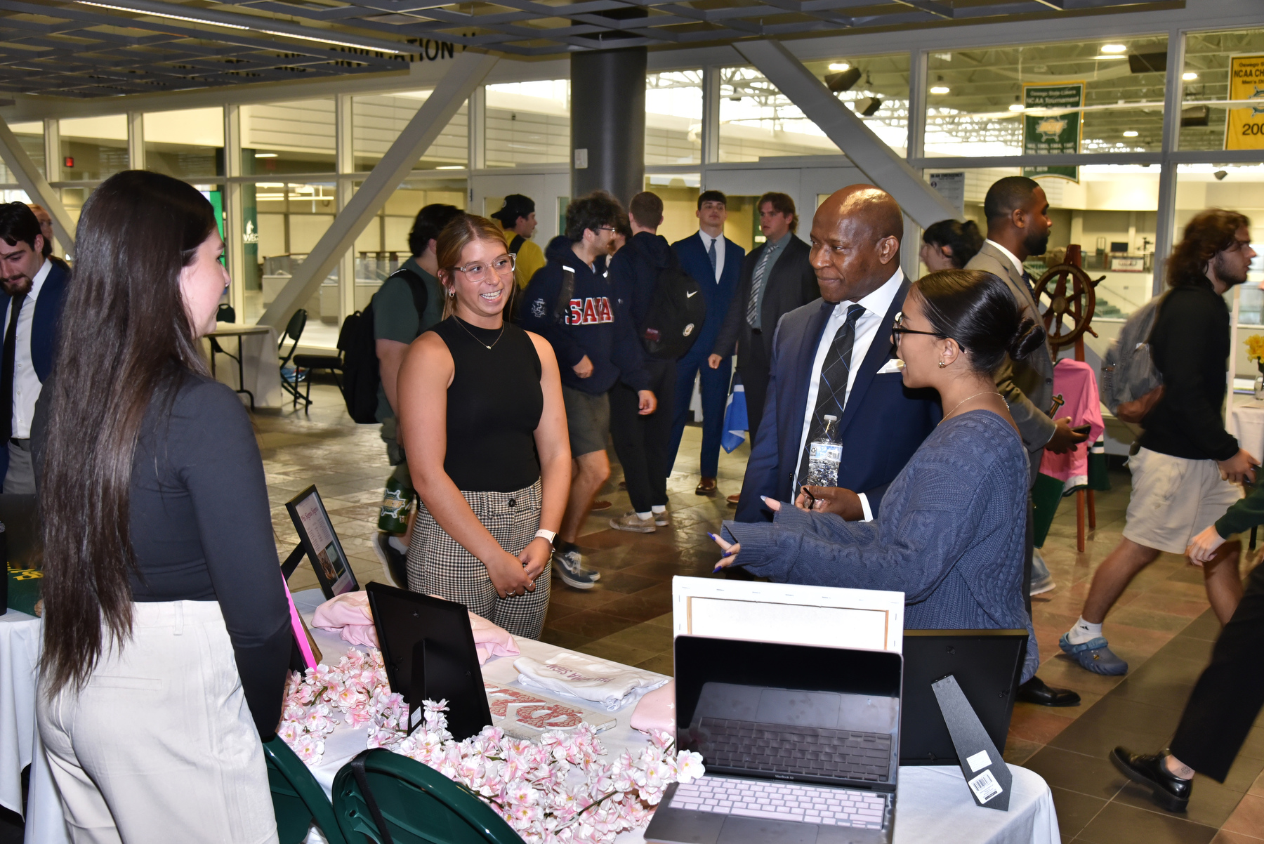 A Student Showcase held Sept. 24 in the Marano Campus Center Hearth Lounge and corridor featured many organizations as part of Inauguration Week. President Peter O. Nwosu visited with each of the student organizations, and is pictured here talking with members of Phi Sigma Sigma sorority.