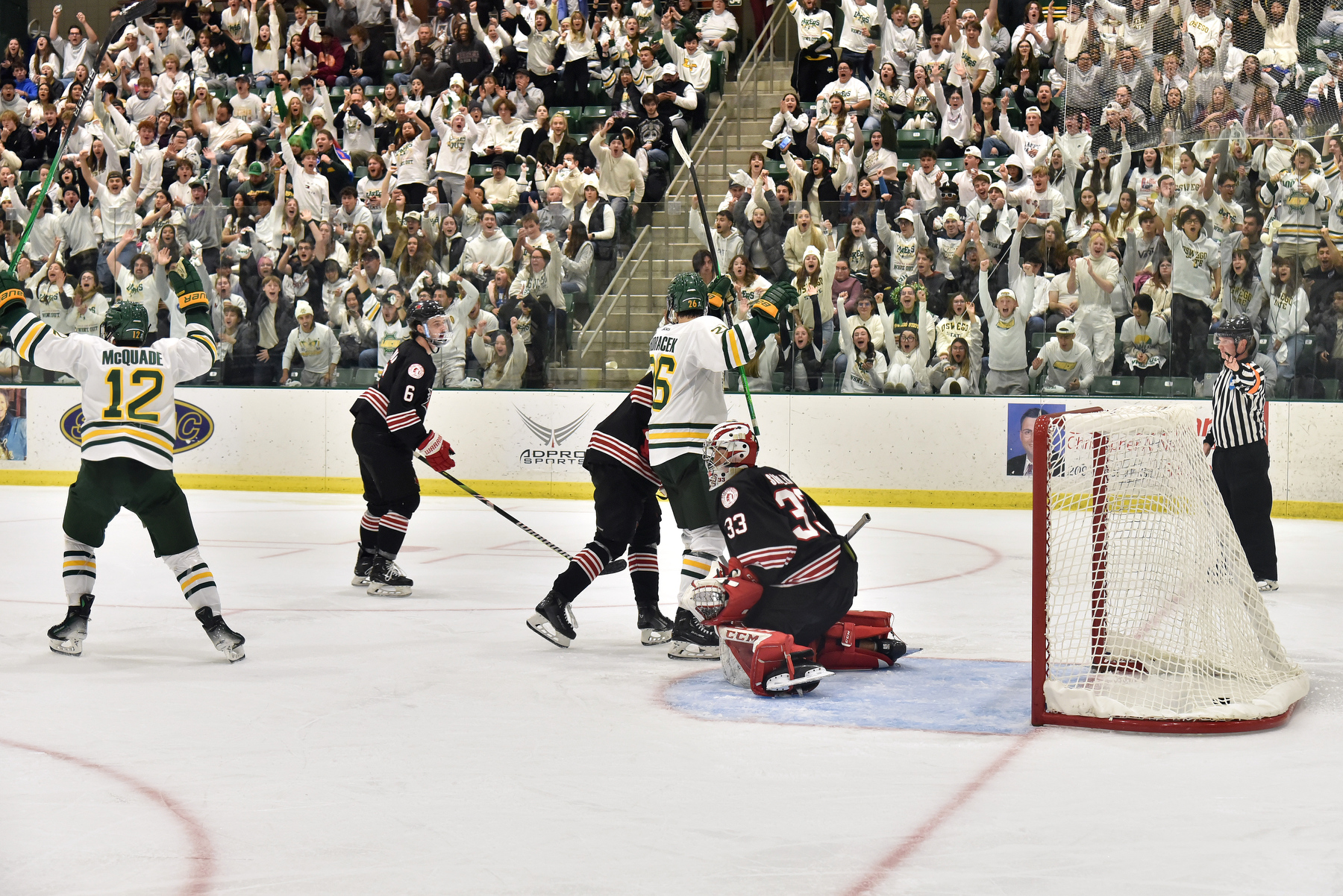 The Laker men’s hockey team celebrates a goal in a 5-1 win over Plattsburgh on Whiteout Weekend.