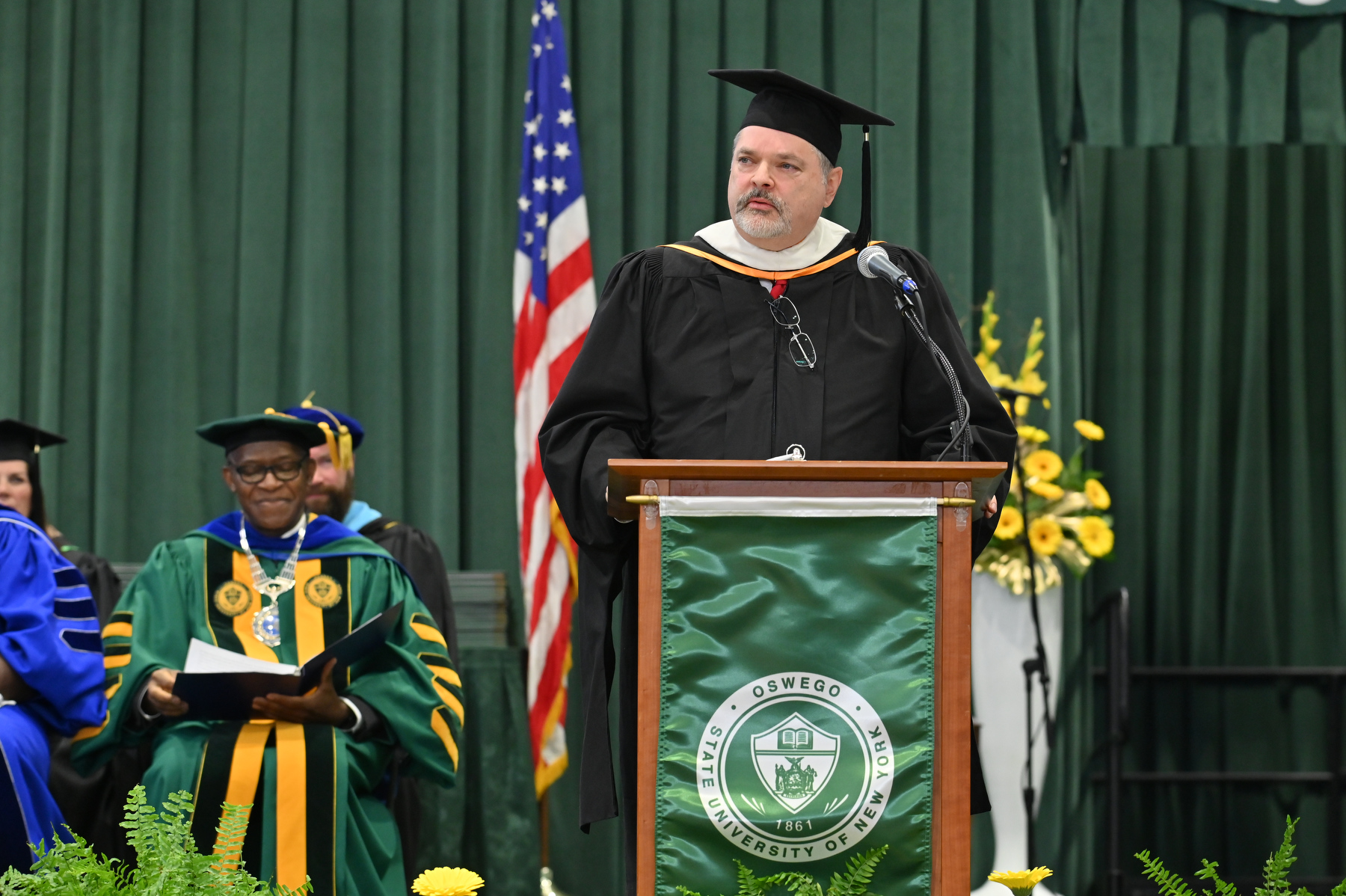 Oswego County Administrator Philip Church served as Commencement speaker, offering words of wisdom and lessons learned.