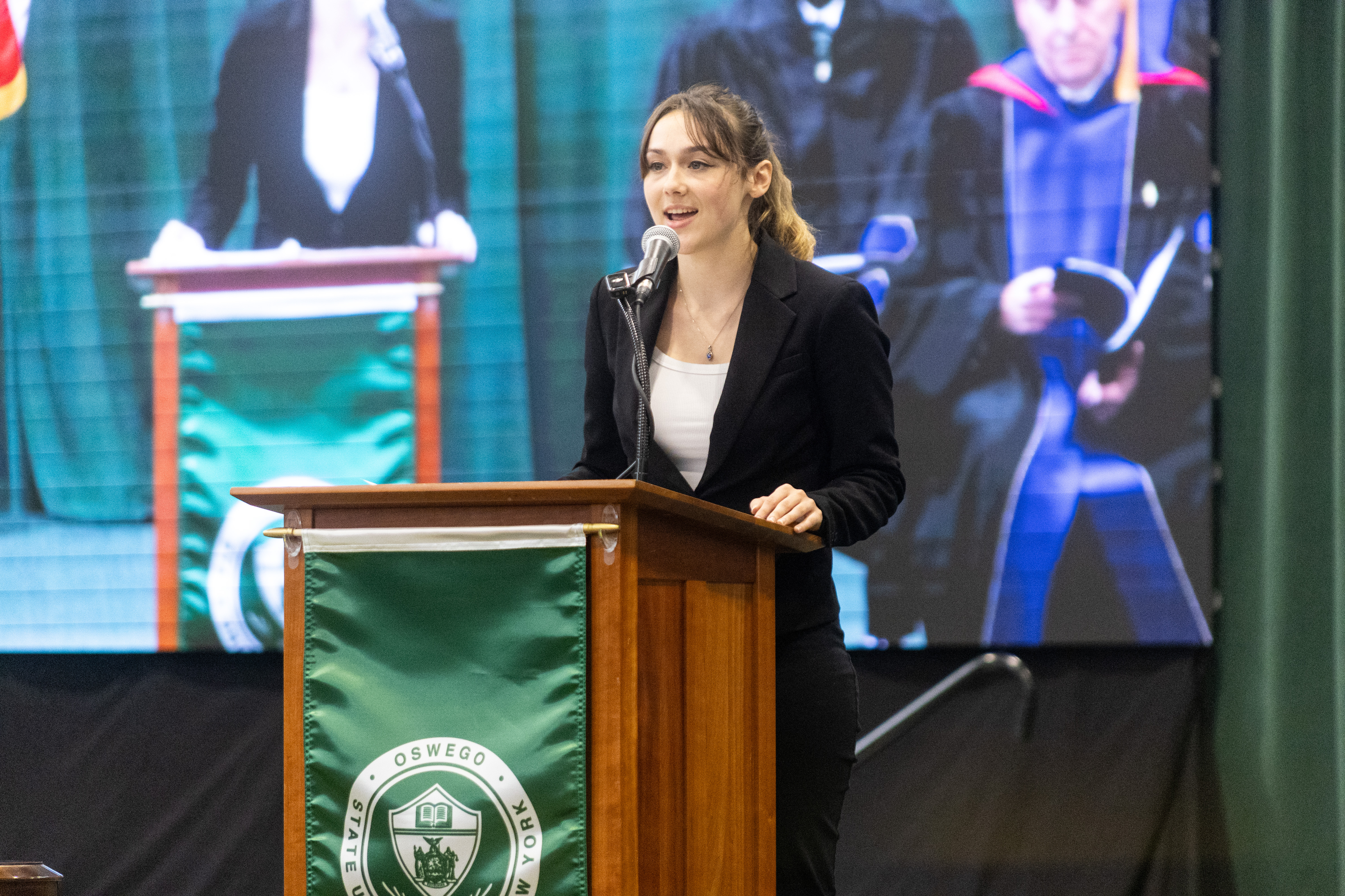 Student poet Emma Deloff reads her original poem, “A Step of Hope,” written specifically for the inauguration of Peter O. Nwosu as SUNY Oswego’s 11th president during the Sept. 27 ceremony.