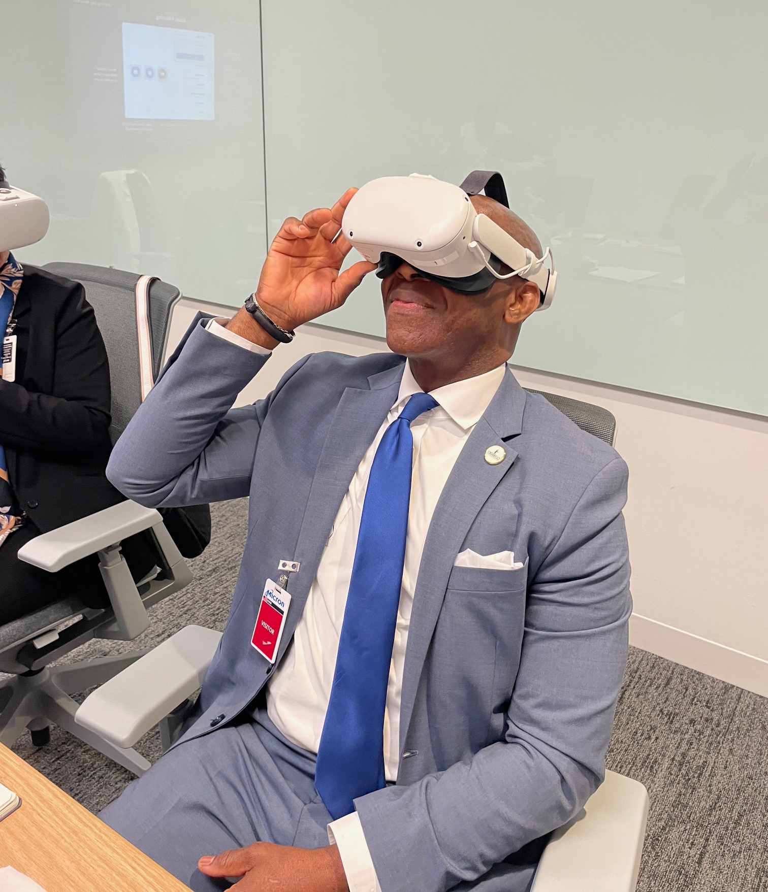 SUNY Oswego President Peter O. Nwosu checks out some virtual reality applications while visiting Micron. 